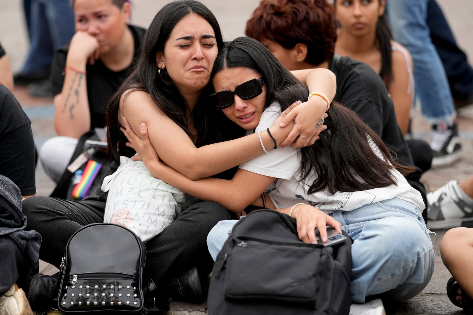 Fans of former One Direction singer Liam Payne gather at the Obelisk to honor him one day after he was found dead at a hotel in Buenos Aires, Argentina, Thursday, Oct. 17, 2024. (AP Photo/Natacha Pisarenko)