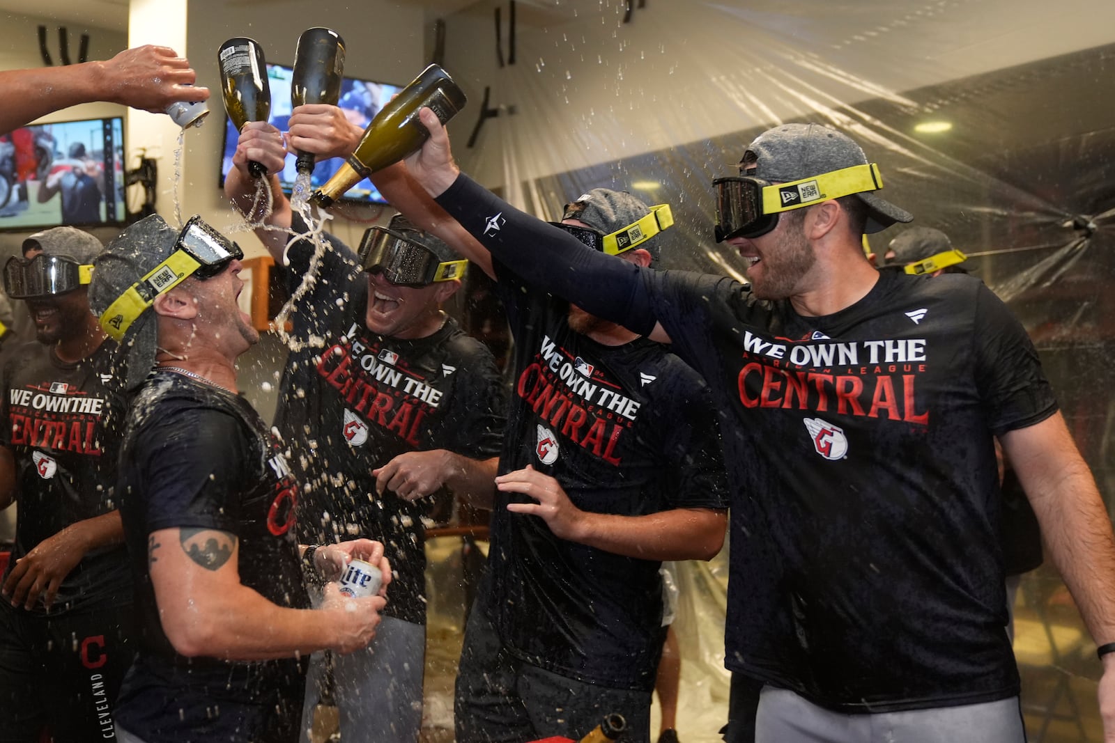 Members of the Cleveland Guardians celebrate winning the American League Central following a baseball game against the St. Louis Cardinals Saturday, Sept. 21, 2024, in St. Louis. (AP Photo/Jeff Roberson)