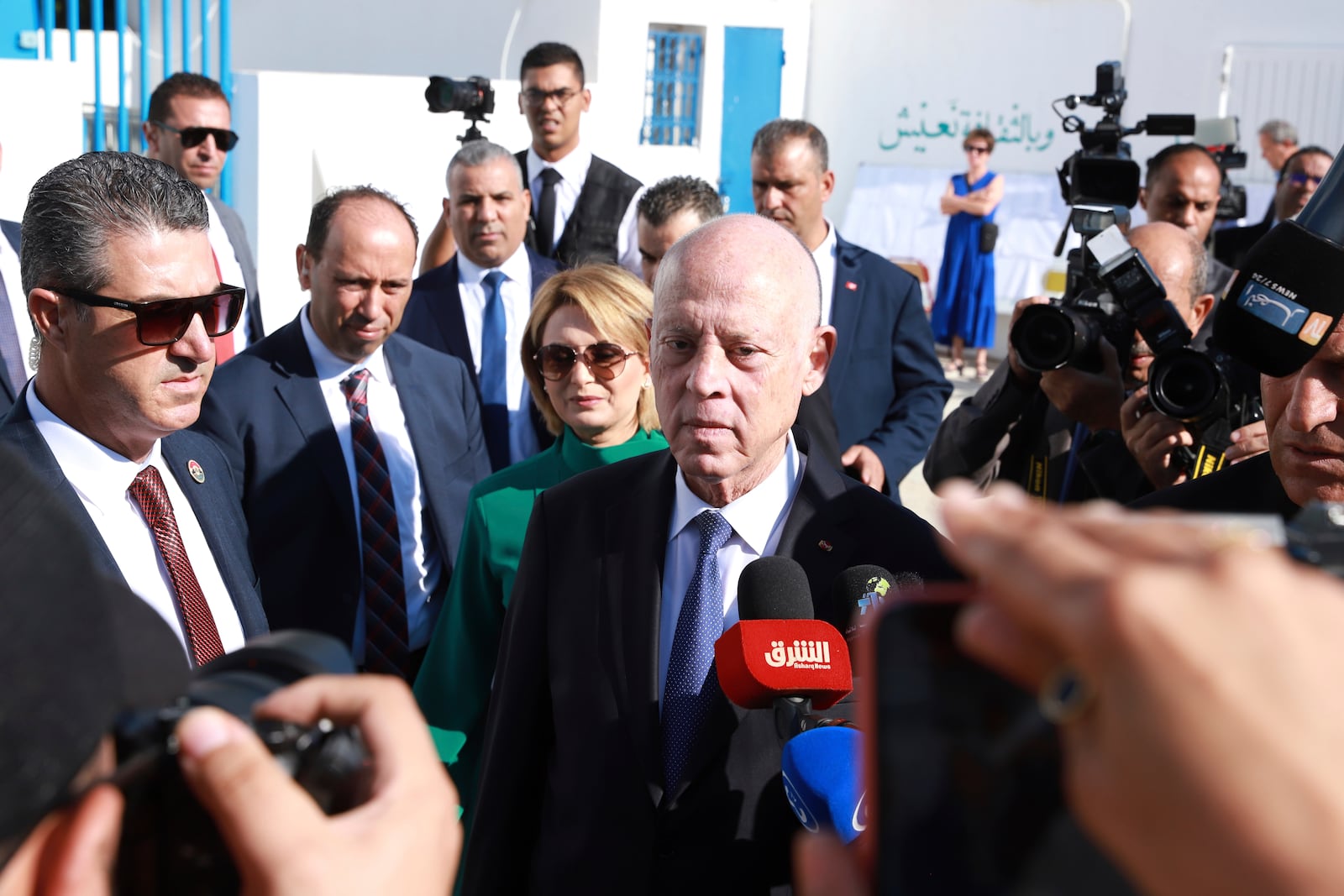 Tunisian President and candidate for re-election Kais Saied, center, and his wife Ichraf Chebil Saïed, leave a polling station after casting their votes, in Tunis, Tunisia, Sunday, Oct. 6, 2024 (AP Photo/Anis Mili)