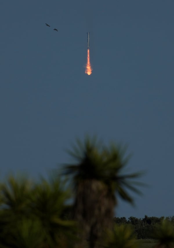 SpaceX's mega rocket booster returns to earth, but not the launch pad at Starbase in Boca Chica, Texas, Tuesday, Nov. 19, 2024. (AP Photo/Eric Gay)