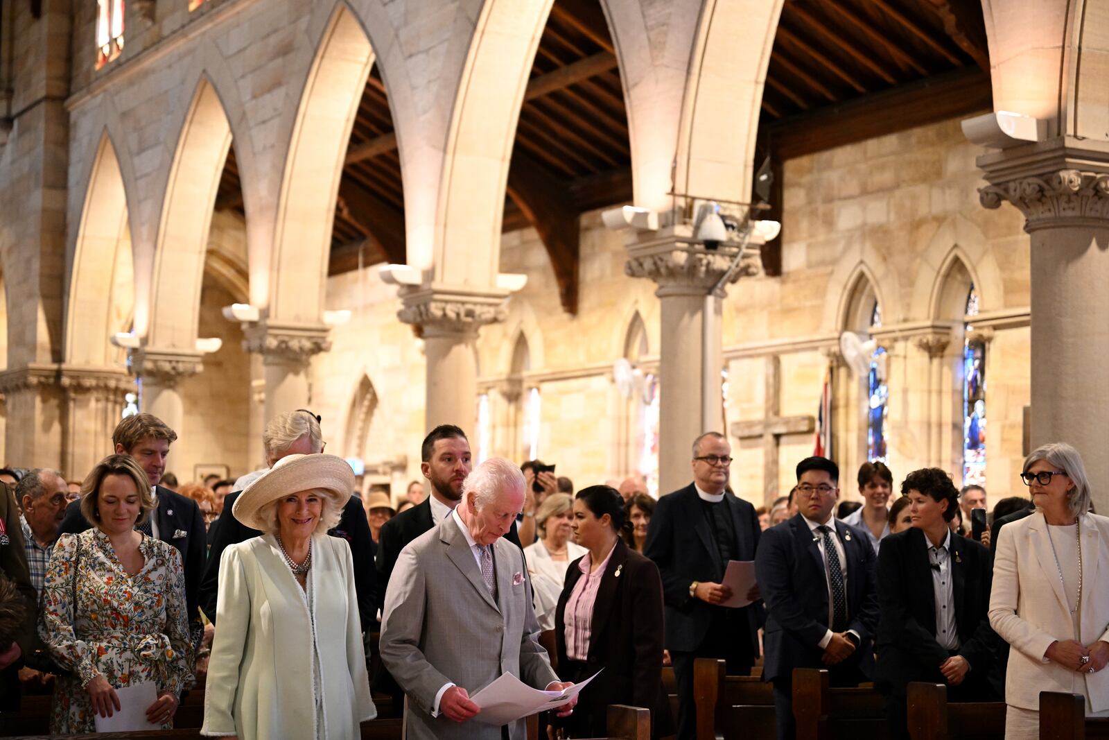 King Charles III, center left, and Queen Camilla, second from front left, stand during a visit to St Thomas' Anglican Church in Sydney, Sunday, Oct. 20, 2024. (Dean Lewins/Pool Photo via AP)