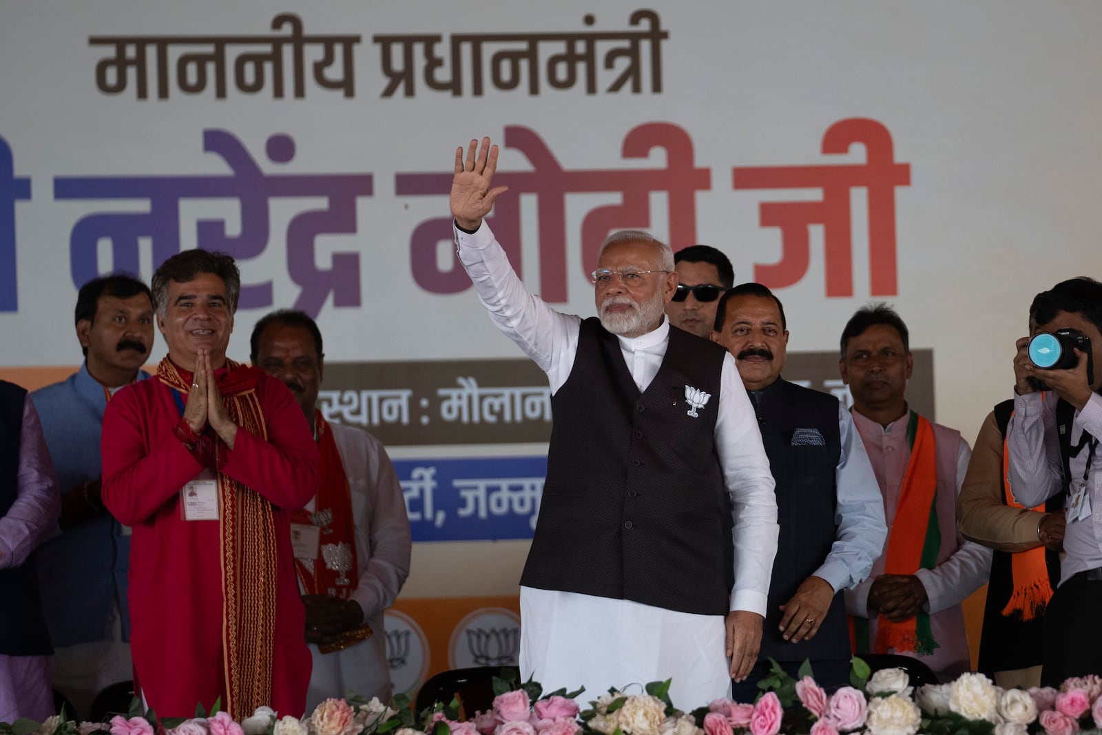 FILE- Indian Prime Minister Narendra Modi, center, waves to supporters during a campaign rally of Jammu and Kashmir Assembly elections in Jammu, India, Sept. 28, 2024. (AP Photo/Channi Anand, File)