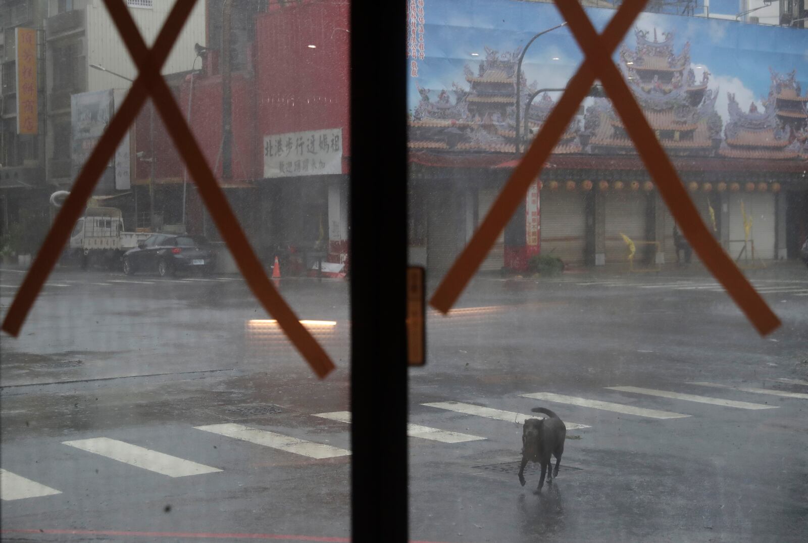 A street view from a hotel that taped the glass of its front door as Typhoon Krathon arrives in Kaohsiung, southern Taiwan, Thursday, Oct. 3, 2024. (AP Photo/Chiang Ying-ying)