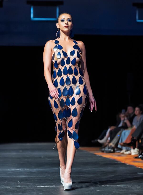 A model wears a design by April Allen on the runway at the 2025 Native Fashion Show, Friday, May 9, 2025, in Santa Fe, N.M. (AP Photo/Roberto E. Rosales)