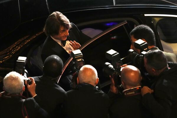 Tom Cruise poses for photographers upon departure from the premiere of the film 'Mission: Impossible – The Final Reckoning' at the 78th international film festival, Cannes, southern France, Wednesday, May 14, 2025. (Photo by Lewis Joly/Invision/AP)