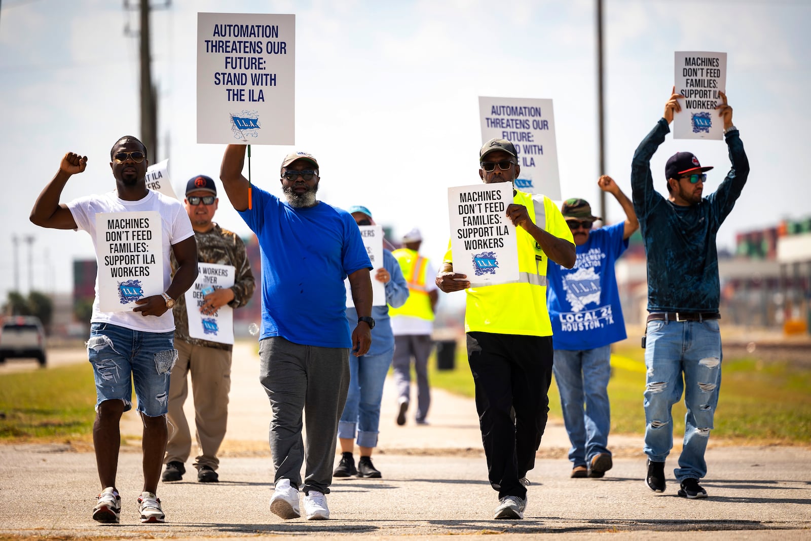 Longshoremen walk the picket line at the Barbours Cut Container Terminal during the first day of a dockworkers strike on Tuesday, Oct. 1, 2024, in Houston. (AP Photo/Annie Mulligan)