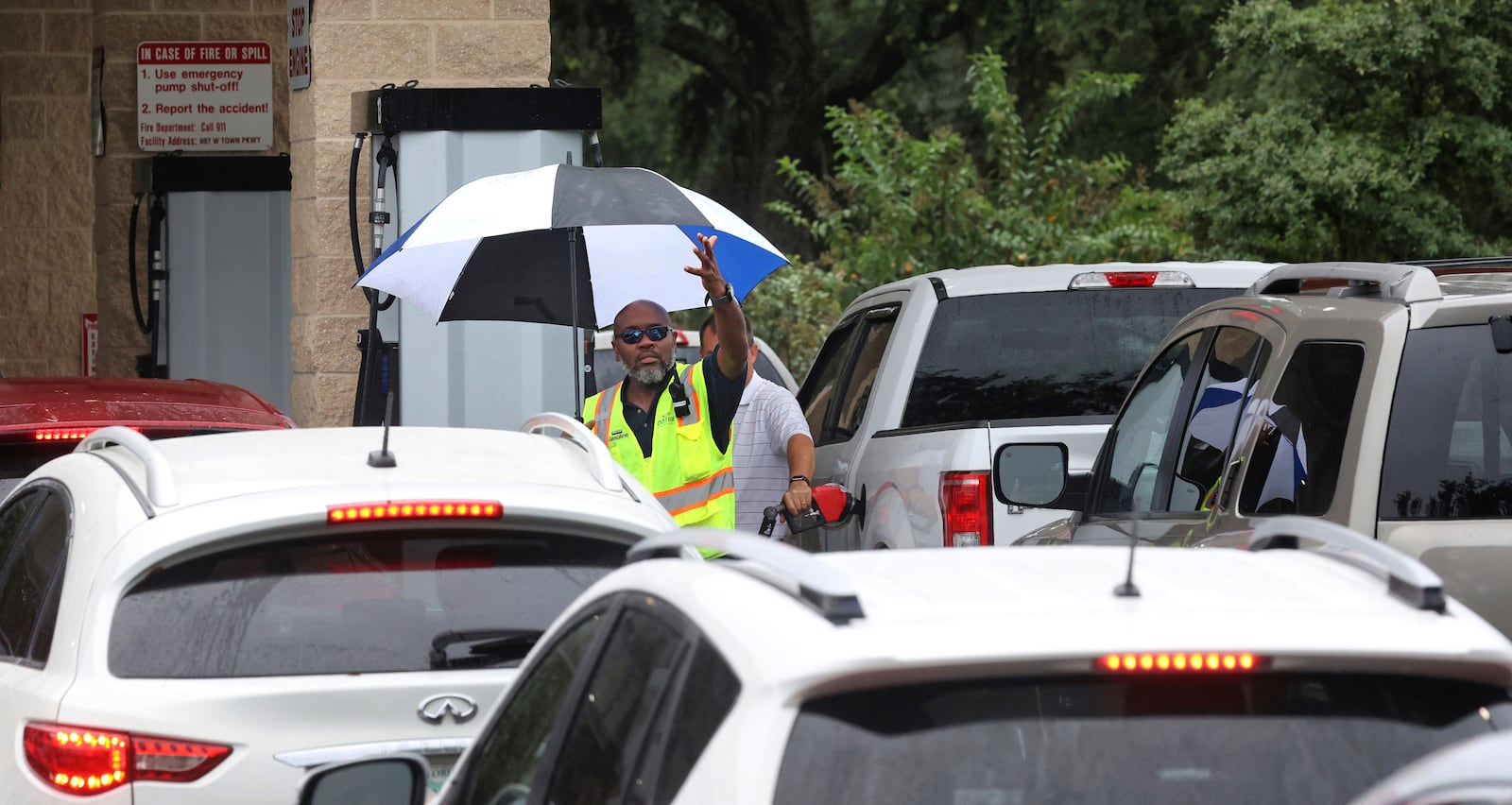 Cars wait in line to get into the parking lot for gas at Costco, Monday, Oct. 7, 2024, in Altamonte Springs, Fla., as residents prepare for the impact of approaching Hurricane Milton. (Joe Burbank/Orlando Sentinel via AP)