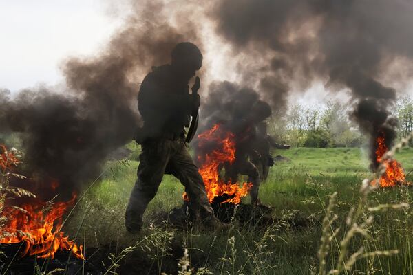 In this photo provided by Ukraine's 65th Mechanized Brigade press service, Ukrainian servicemen attend a military training in Zaporizhzhia region, Ukraine, Monday, May 26, 2025. (Andriy Andriyenko/Ukraine's 65th Mechanized Brigade via AP)