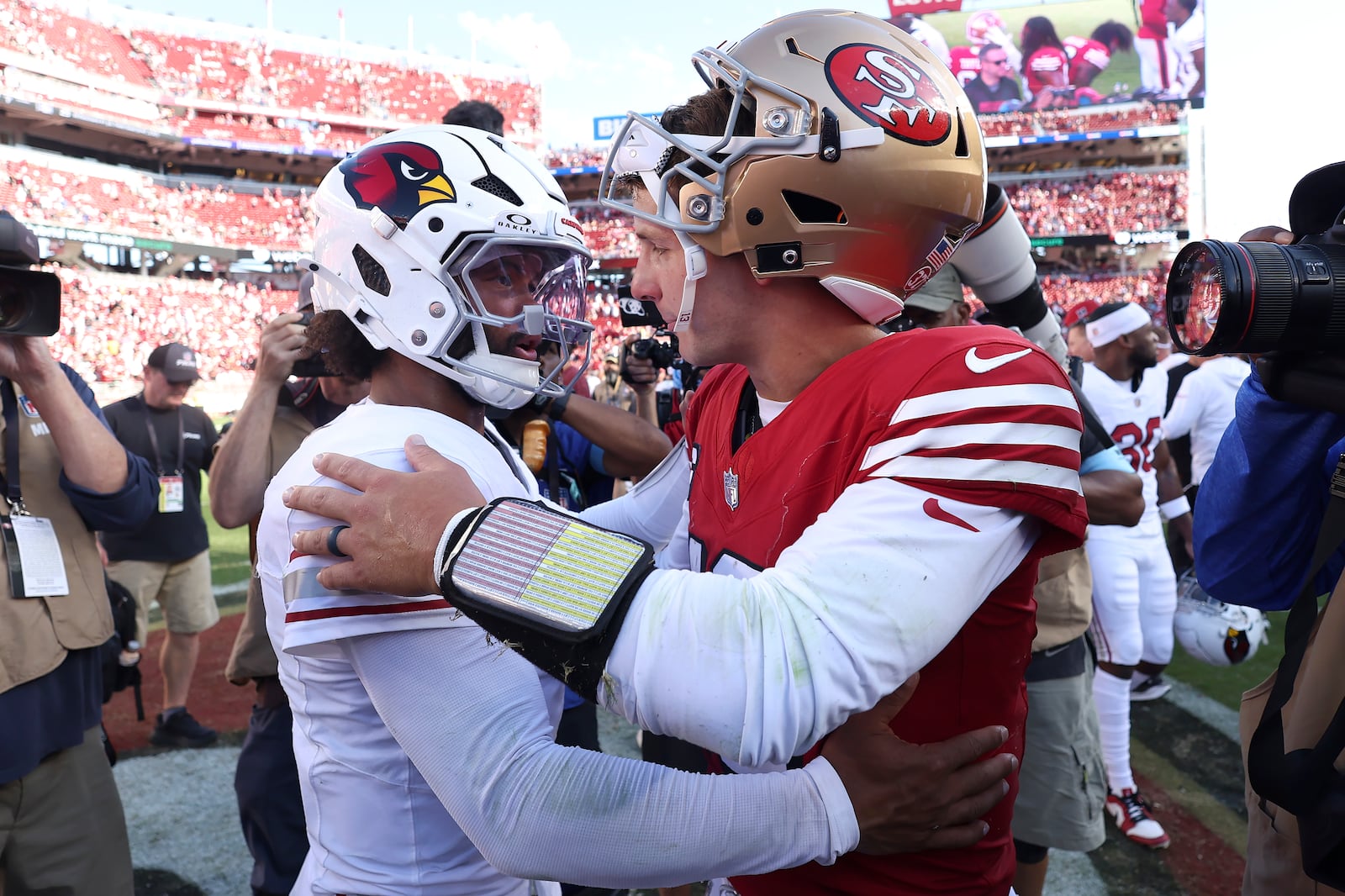 Arizona Cardinals quarterback Kyler Murray, left, greets San Francisco 49ers quarterback Brock Purdy after an NFL football game in Santa Clara, Calif., Sunday, Oct. 6, 2024. (AP Photo/Jed Jacobsohn)