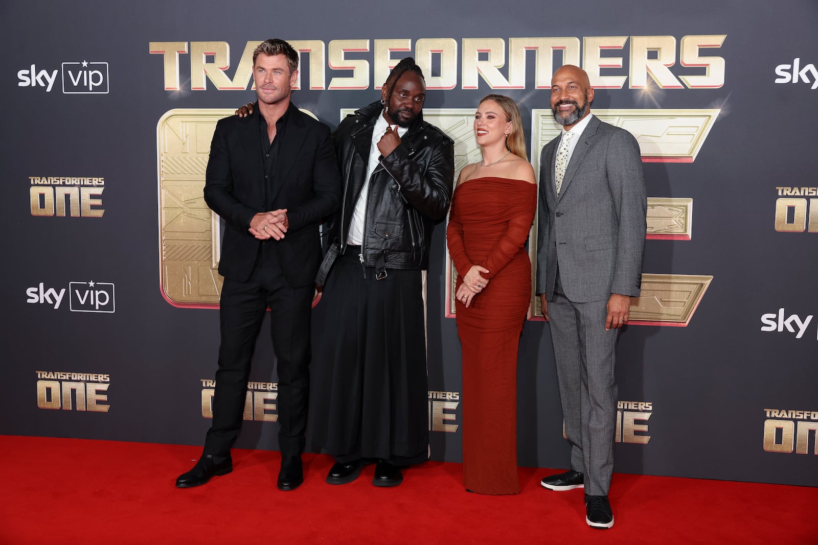 Chris Hemsworth, from left, Brian Tyree Henry, Scarlett Johansson and Keegan-Michael Key pose for photographers upon arrival at the premiere for the film 'Transformers One' on Thursday, Sept. 19, 2024 in London. (Photo by Vianney Le Caer/Invision/AP)