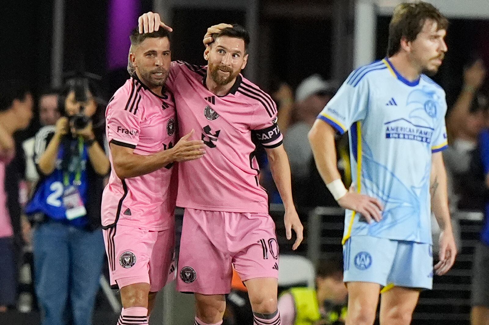 Inter Miami defender Jordi Alba, left, celebrates his goal with forward Lionel Messi (10) during the second half of their MLS playoff opening round soccer match against Atlanta United, Friday, Oct. 25, 2024, in Fort Lauderdale, Fla. (AP Photo/Lynne Sladky)