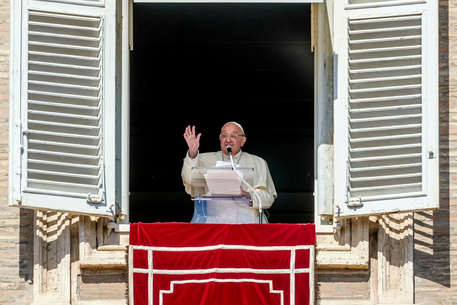 Pope Francis appears at the window of his studio for the traditional noon blessing of faithful and pilgrims gathered in St. Peter's Square at The Vatican, Thursday, Dec. 7, 2006. (AP Photo/Andrew Medichini)