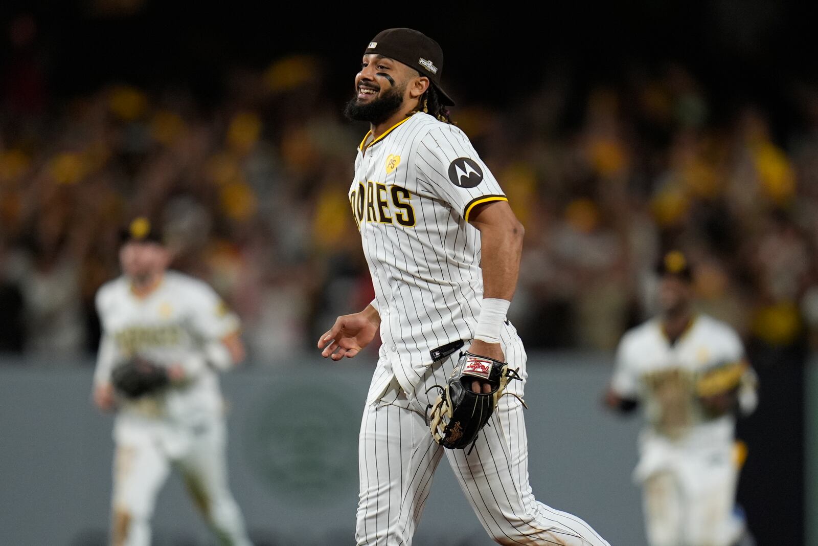 San Diego Padres' Fernando Tatis Jr. smiles after a win over the Atlanta Braves in Game 2 of an NL Wild Card Series baseball game Wednesday, Oct. 2, 2024, in San Diego. (AP Photo/Gregory Bull)