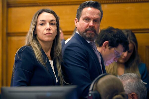 Karen Read and attorney Alan Jackson look at the empty jury box while listening to Judge Cannone during Read's murder trial in Norfolk Superior Court in Dedham, Mass., Wednesday, May 21, 2025. (Greg Derr/The Patriot Ledger via AP, Pool)