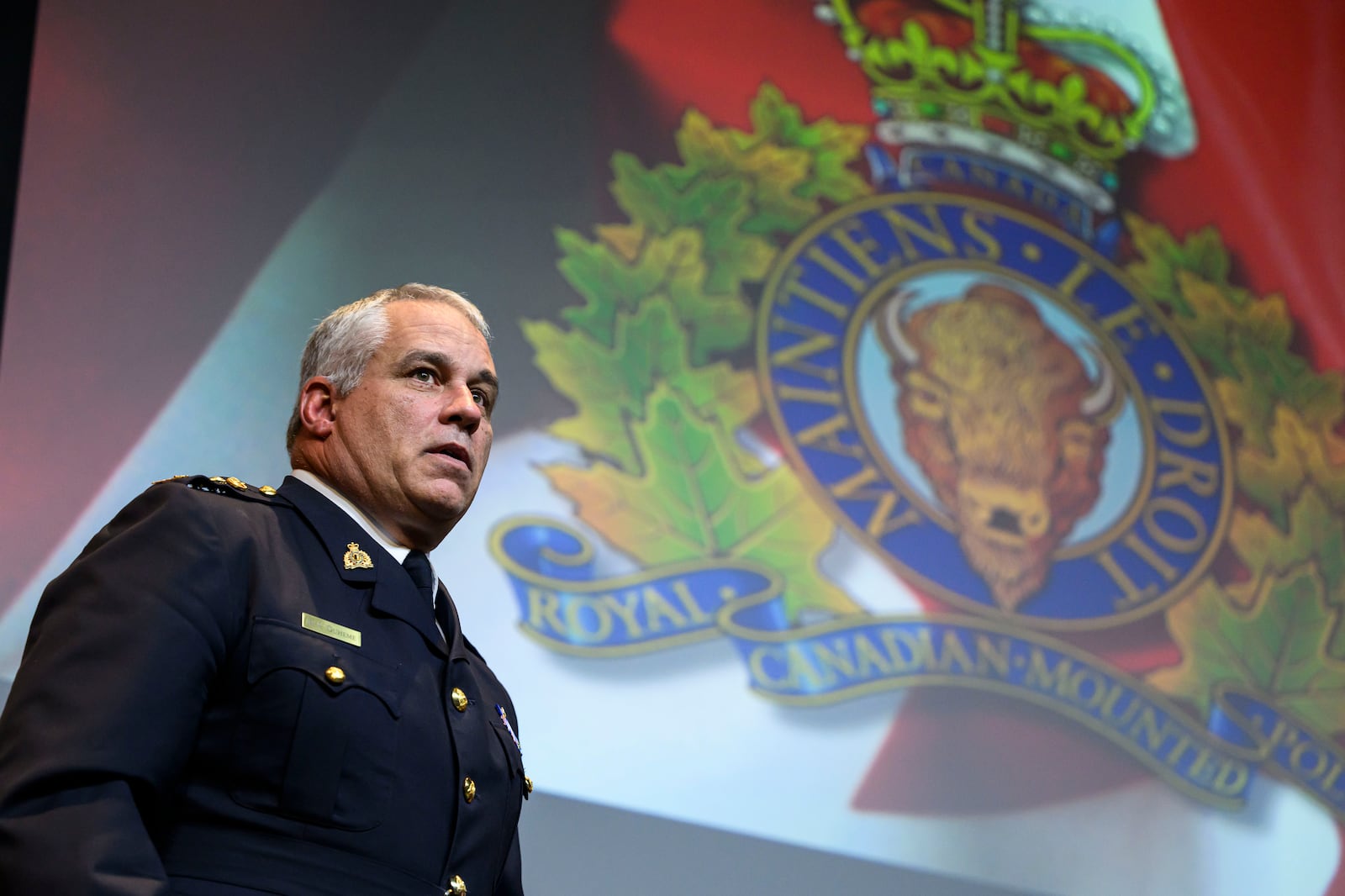 RCMP Commissioner Mike Duheme departs at the end of a news conference at RCMP National Headquarters in Ottawa, Ontaio, Monday, Oct. 14, 2024. (Justin Tang/The Canadian Press via AP)