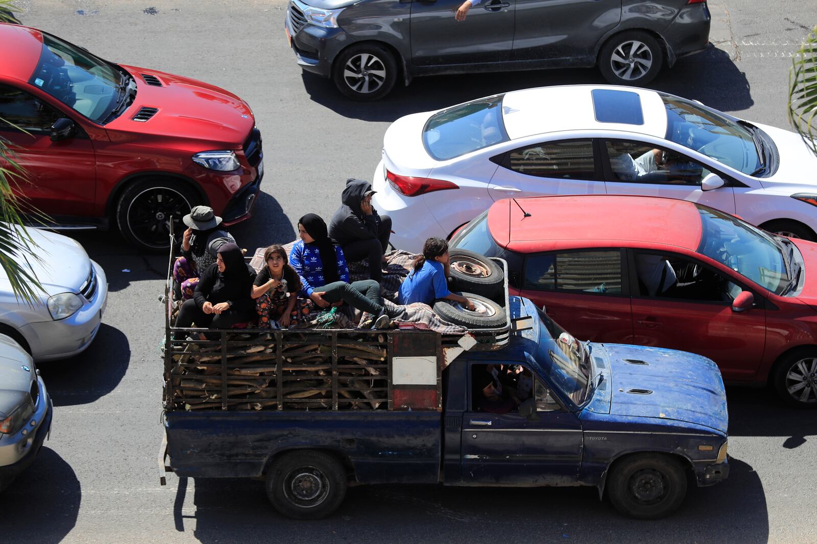 Cars sit in traffic as people flee the southern villages amid ongoing Israeli airstrikes, in Sidon, Lebanon, Monday, Sept. 23, 2024. (AP Photo/Mohammed Zaatari)