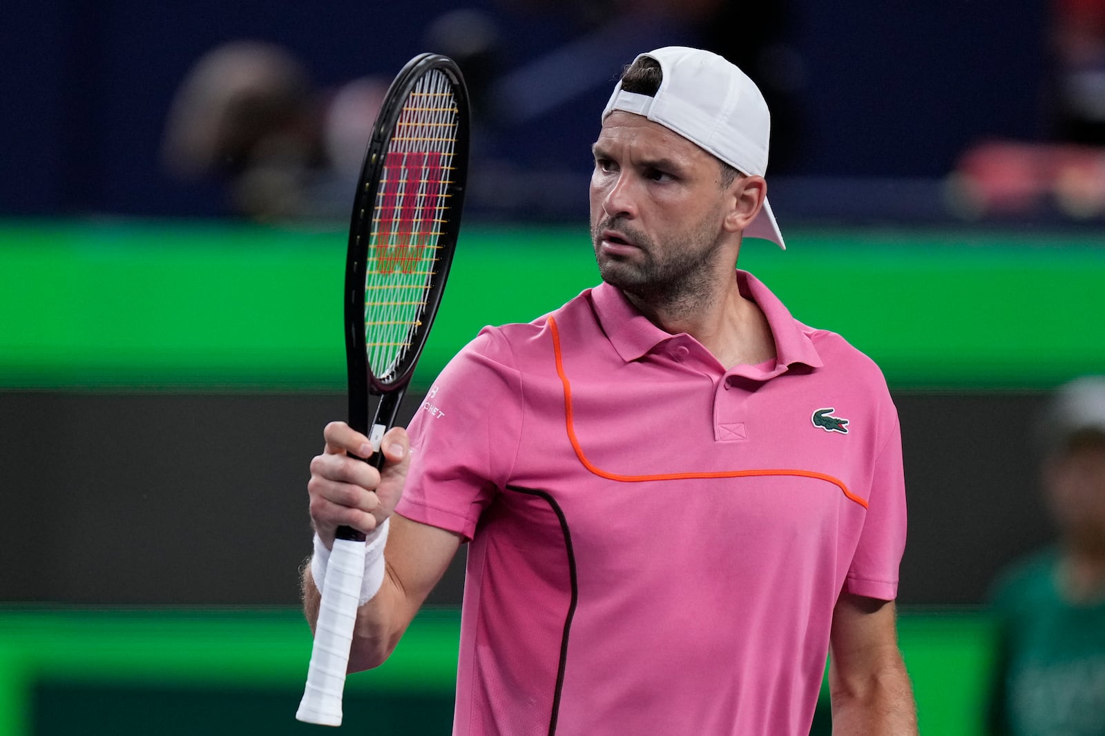 Grigor Dimitrov of Bulgaria reacts during the men's singles second round match against Zizou Bergs of Belgium in the Shanghai Masters tennis tournament at Qizhong Forest Sports City Tennis Center in Shanghai, China, Monday, Oct. 7, 2024. (AP Photo/Andy Wong)