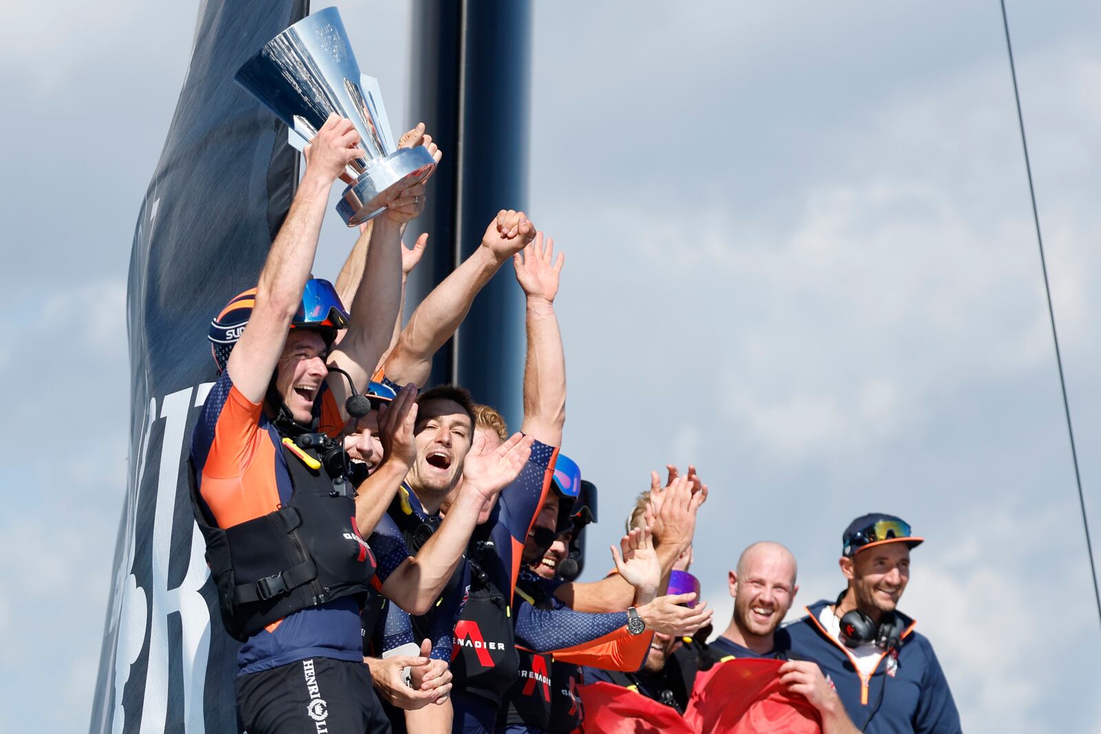 INEOS Britannia crew celebrate their victory against the Luna Rosa Prada Pirelli's sailing team during the Louis Vuitton Cup Final Day 7 at the Barcelona's coast, Spain, Friday, Oct. 4, 2024. (AP Photo/Joan Monfort)