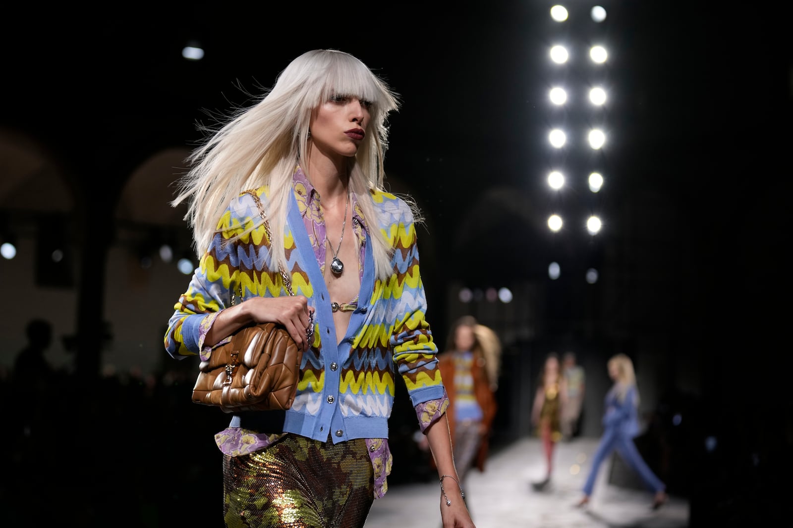 A model wears a creation as part of the Versace Spring Summer 2025 collection, that was presented in Milan, Italy, Friday, Sept. 20, 2024. (AP Photo/Antonio Calanni)