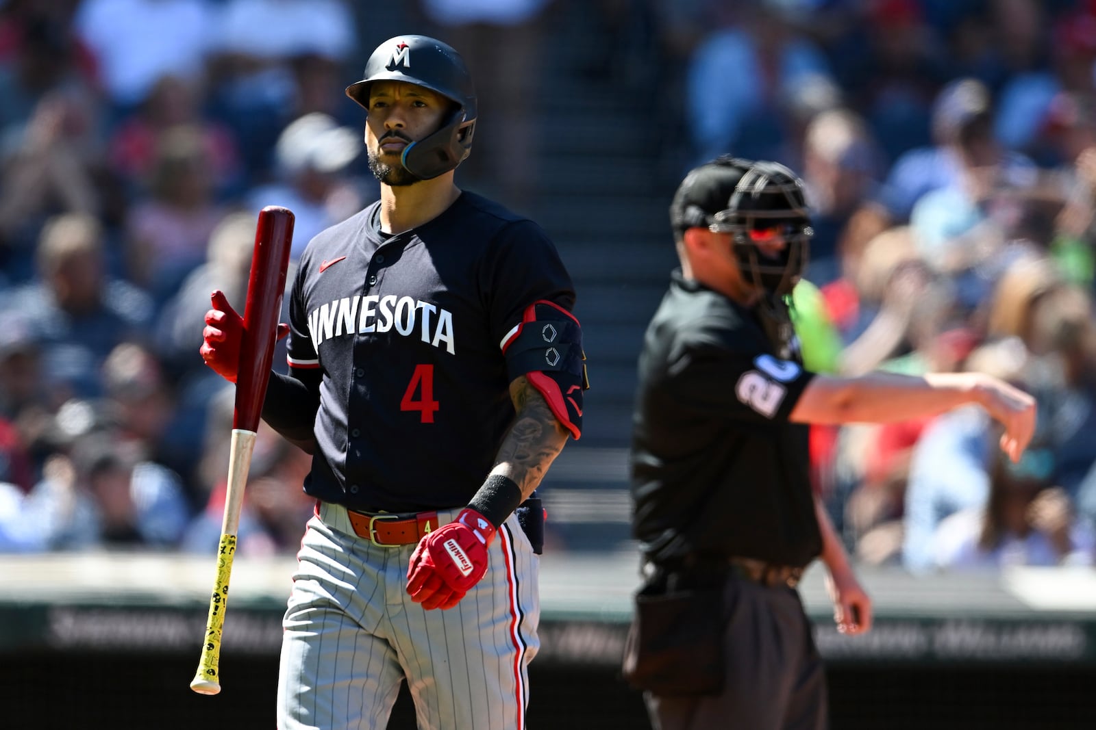 Minnesota Twins' Carlos Correa reacts after striking out during the third inning of a baseball game against the Cleveland Guardians, Thursday, Sept. 19, 2024, in Cleveland. (AP Photo/Nick Cammett)