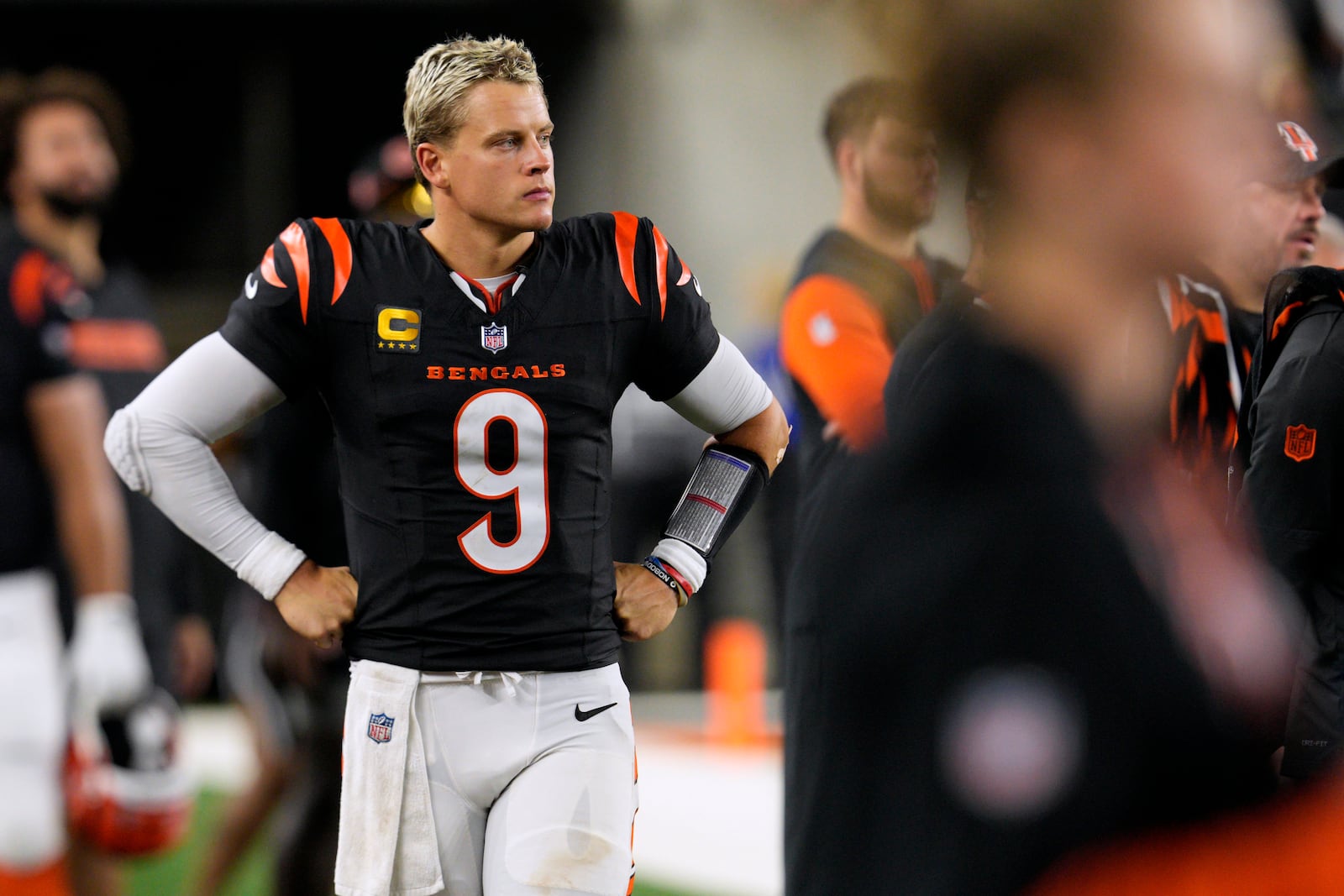 Cincinnati Bengals quarterback Joe Burrow (9) watches from the sideline during the second half of an NFL football game against the Washington Commanders, Monday, Sept. 23, 2024, in Cincinnati. (AP Photo/Jeff Dean)