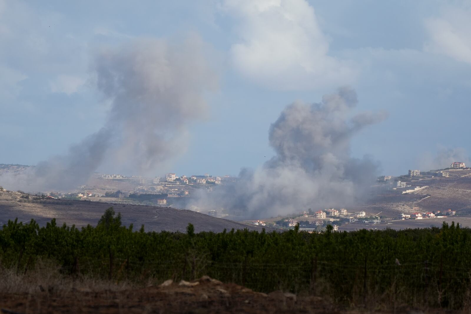 Smoke rises following Israeli bombardment in southern Lebanon as seen from northern Israel, Wednesday, Oct. 2, 2024. (AP Photo/Baz Ratner)