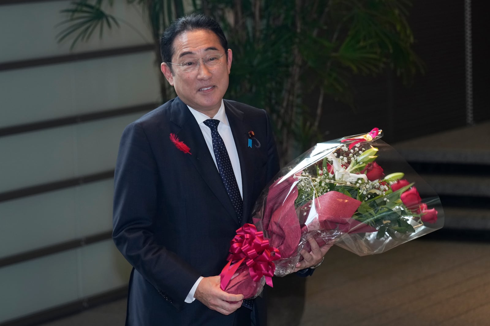 Japan's outgoing Prime Minister Fumio Kishida stops as media members asked him to make a comment before he leaves the prime minister's office in Tokyo Tuesday, Oct. 1, 2024. (AP Photo/Hiro Komae)