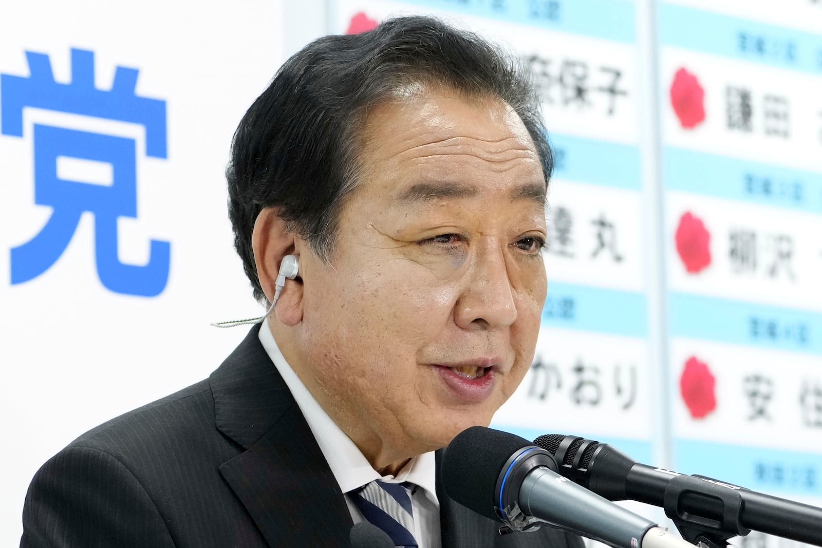 Yoshihiko Noda, leader of Japan's opposition Constitutional Democratic Party, speaks to the media regarding the lower house election, at the party's headquarters Sunday, Oct. 27, 2024 in Tokyo, (Kyodo News via AP)