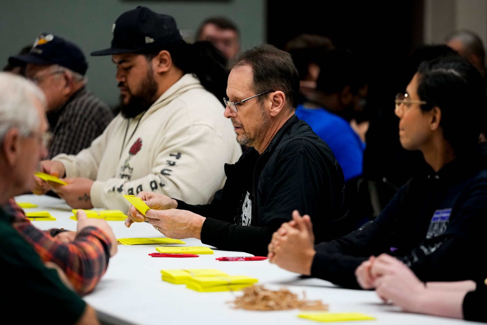 Volunteers tally votes on a new contract offer from Boeing, Wednesday, Oct. 23, 2024, at Seattle Union Hall in Seattle. (AP Photo/Lindsey Wasson)