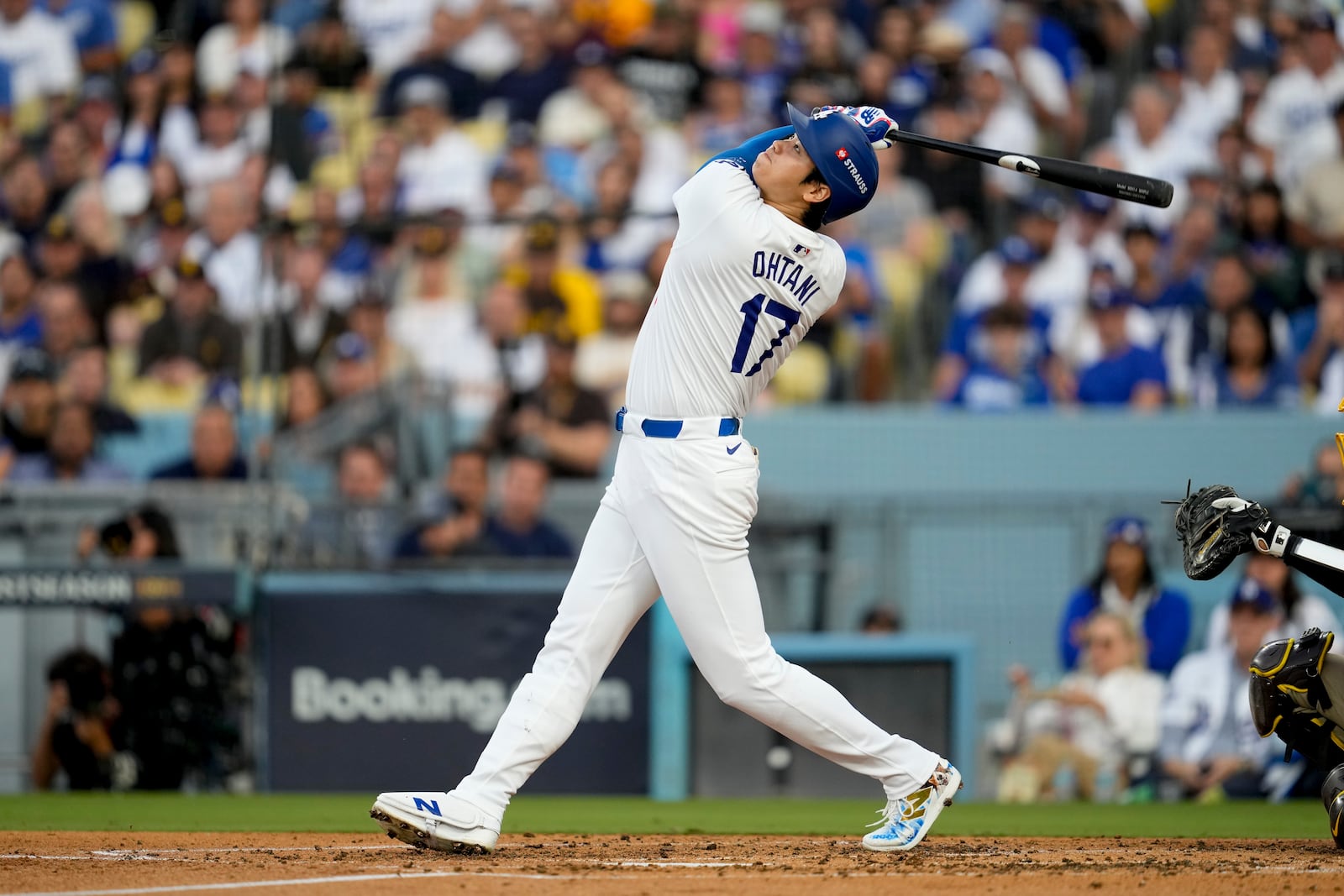 Los Angeles Dodgers' Shohei Ohtani pops out during the third inning in Game 5 of a baseball NL Division Series against the San Diego Padres, Friday, Oct. 11, 2024, in Los Angeles. (AP Photo/Ashley Landis)