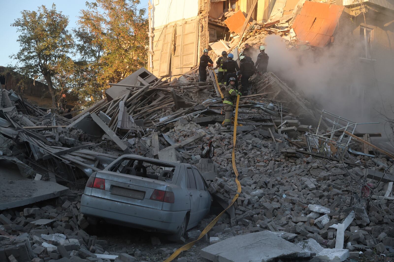 Rescue workers clear the rubble of a residential building destroyed by a Russian airstrike in Zaporizhzhia, Ukraine, Thursday, Nov. 7, 2024. (AP Photo/Kateryna Klochko)