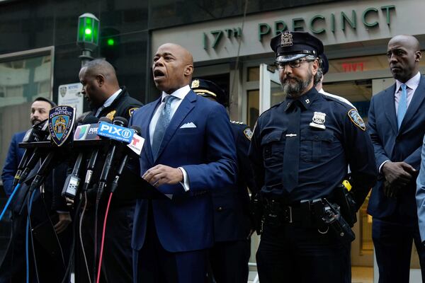 This image provided by Office of the New York Mayor shows New York Mayor Eric Adams, left center, as he briefs the media on a series of incidents that took place within the confines of the 10th and 17th Police Precincts, Monday, Nov. 18, 2024. (Mayoral Photography Office/Michael Appleton via AP)