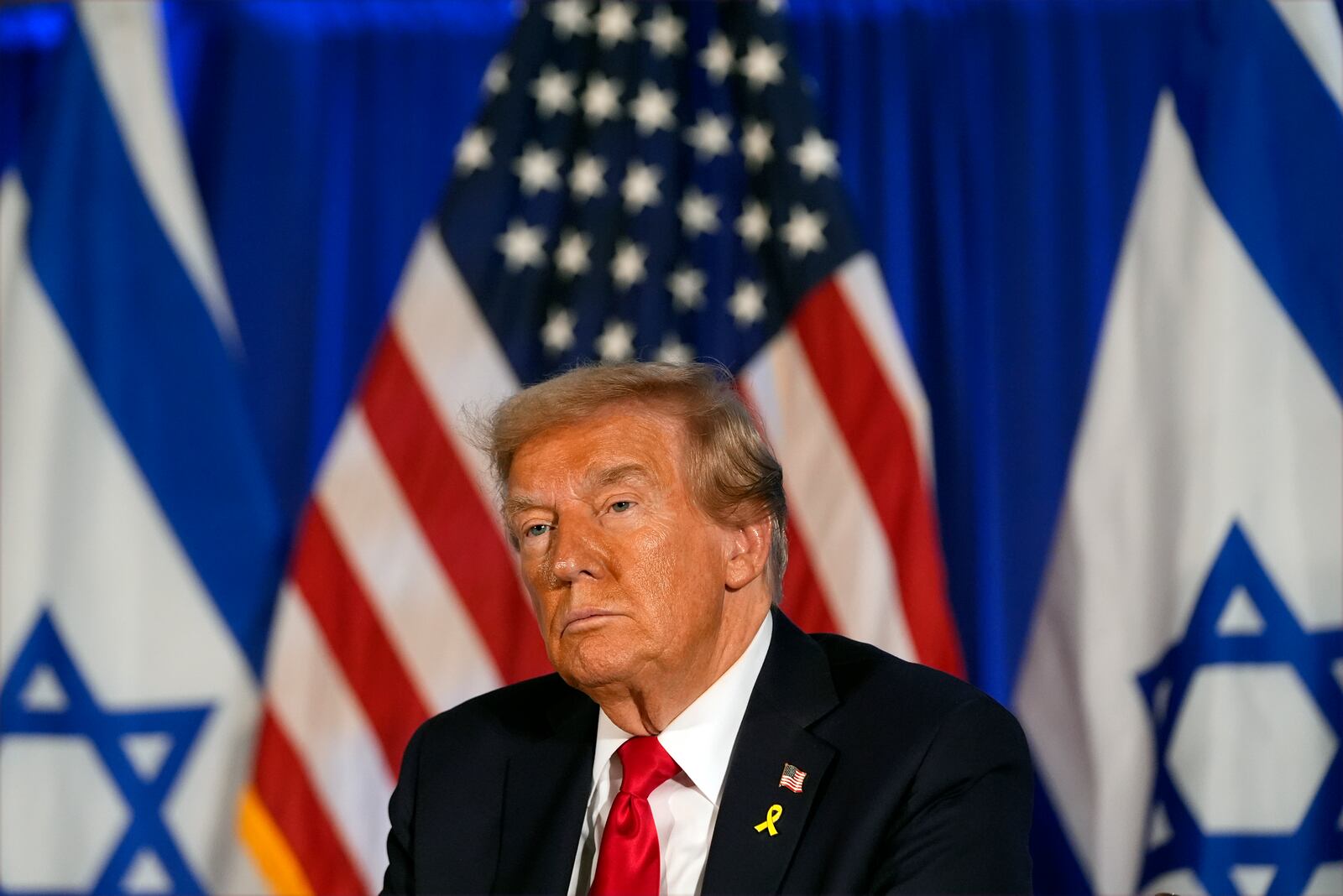 Republican presidential nominee former President Donald Trump listens at an event marking one year since the Oct. 7 Hamas attack on Israel, Monday, Oct. 7, 2024, in Miami. (AP Photo/Alex Brandon)