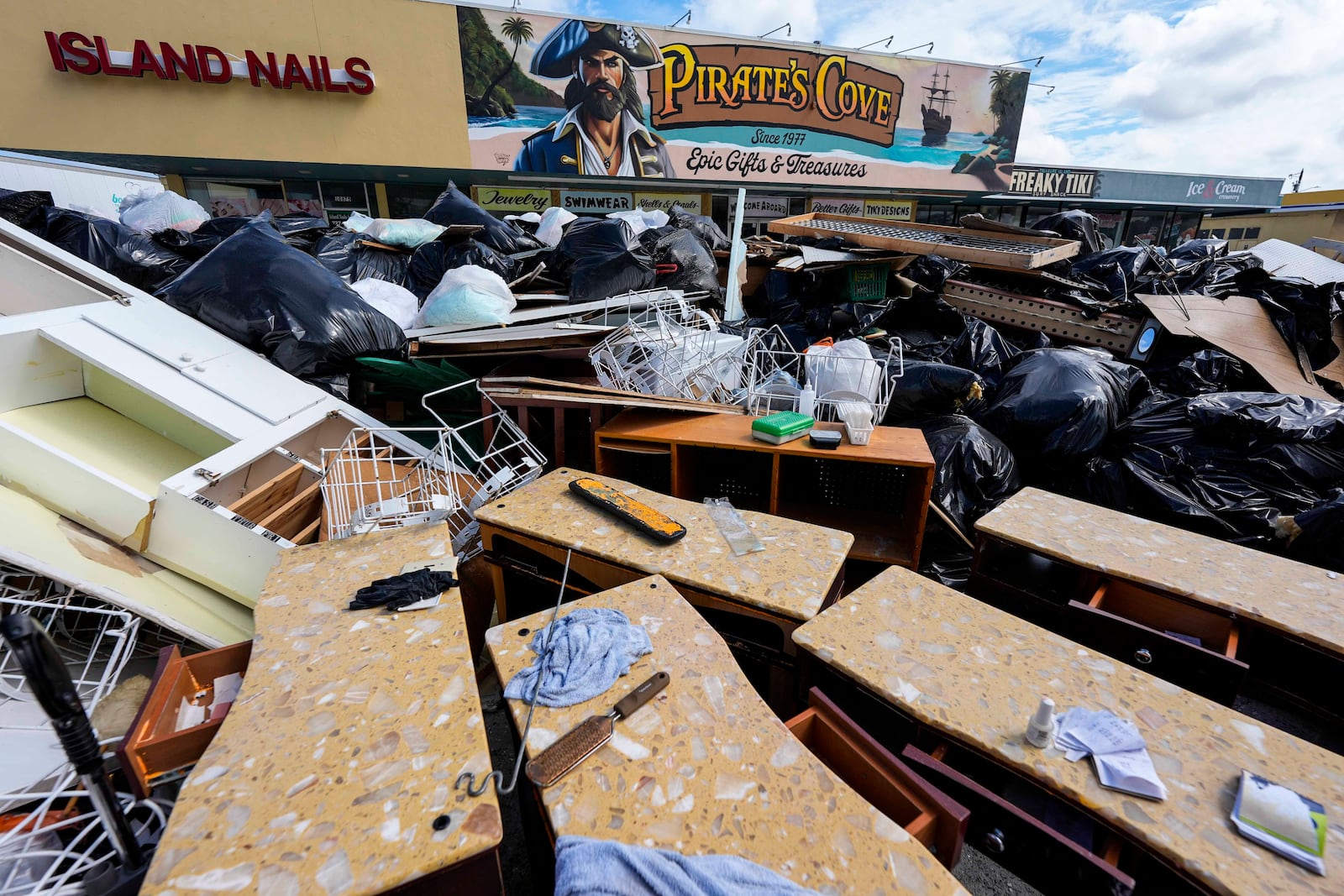 A closed business is seen after Hurricane Helene ahead of Hurricane Milton's arrival, Tuesday, Oct. 8, 2024, in Treasure Island, Fla. (AP Photo/Mike Stewart)