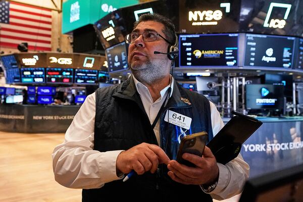 Trader Michael Capolino works on the floor of the New York Stock Exchange, Thursday, May 8, 2025. (AP Photo/Richard Drew)