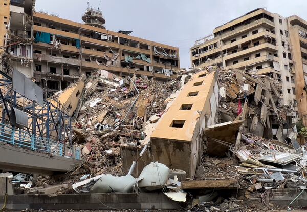 A destroyed building that was hit in an Israeli airstrike in Dahiyeh, in the southern suburb of Beirut, Lebanon, Tuesday, Nov. 19, 2024. (AP Photo/Hussein Malla)