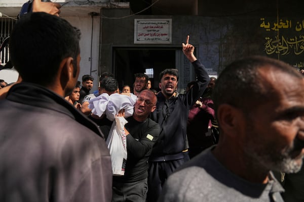 Bodies of some of the victims of an Israeli army strike on a restaurant, which killed at least 29 people, are carried at the Shifa hospital in Gaza City, Wednesday, May 7, 2025.(AP Photo/Jehad Alshrafi)