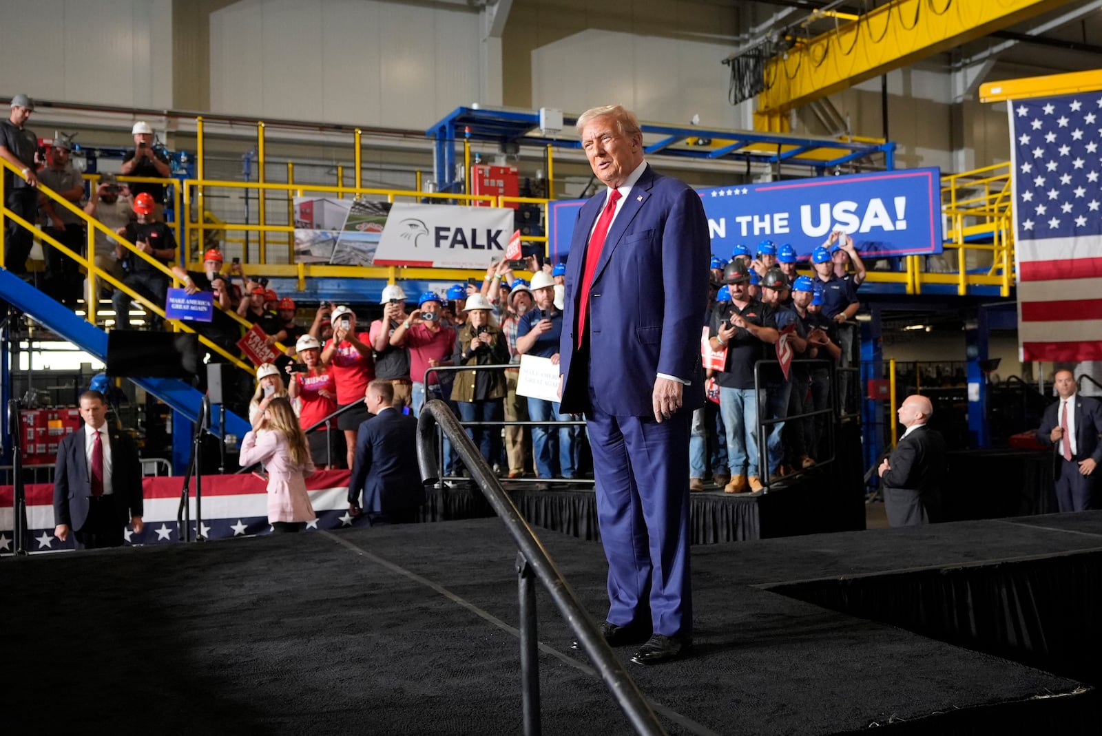 Republican presidential nominee former President Donald Trump arrives at a campaign event, Friday, Sept. 27, 2024 in Walker, Mich. (AP Photo/Carlos Osorio)