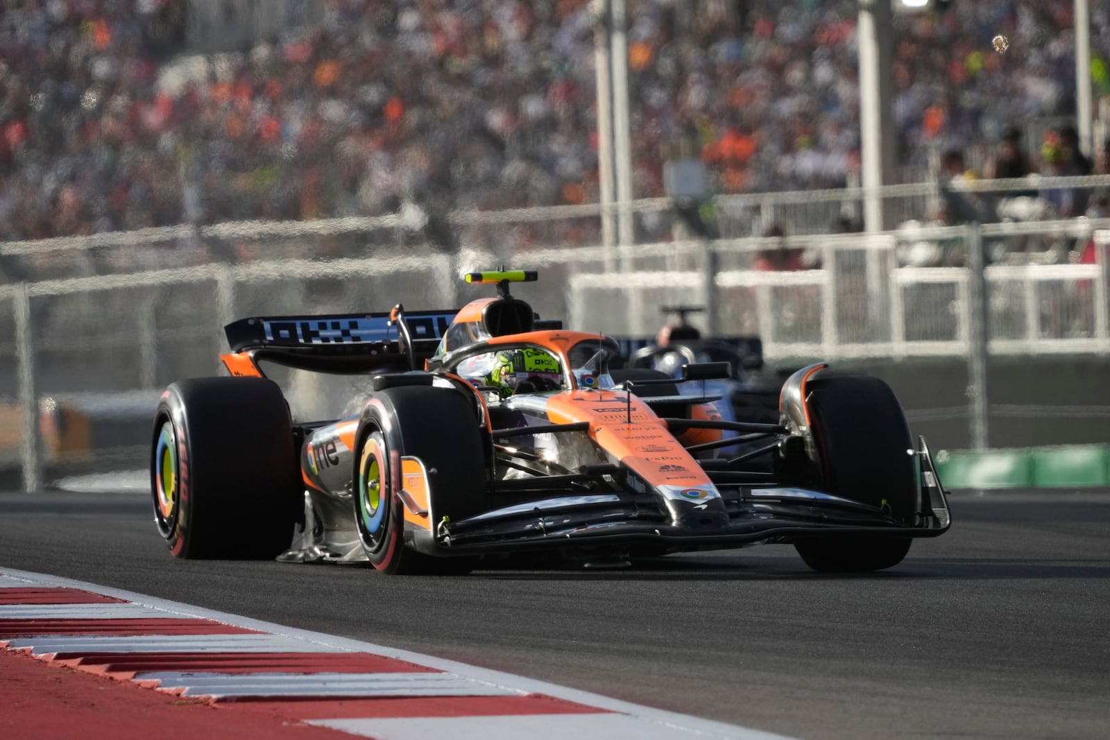 McLaren driver Lando Norris, of Britain, steers out of a turn during a qualifying session for the Formula One U.S. Grand Prix auto race at Circuit of the Americas, Saturday, Oct. 19, 2024, in Austin, Texas. (AP Photo/Eric Gay)