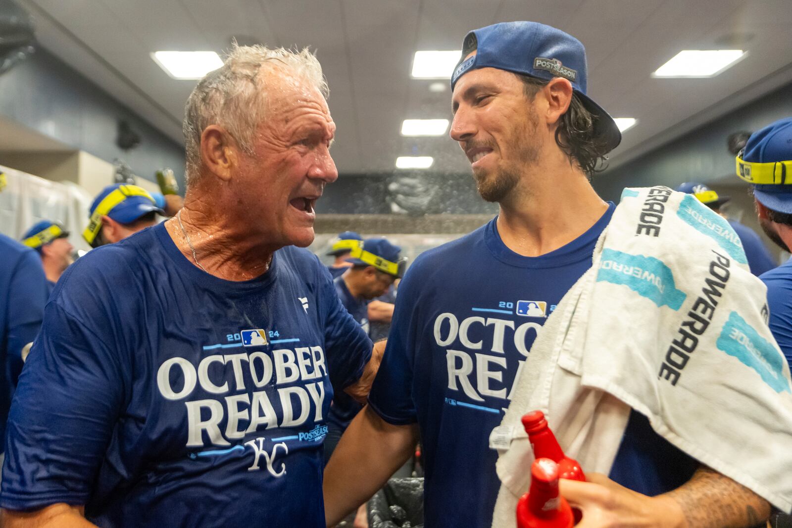 Hall of Fame Kansas City Royals infielder George Brett, left, congratulates pitcher Michael Lorenzen, right, during a celebration in the locker room after a baseball game against the Atlanta Braves, Friday, Sept. 27, 2024, in Atlanta. (AP Photo/Jason Allen)