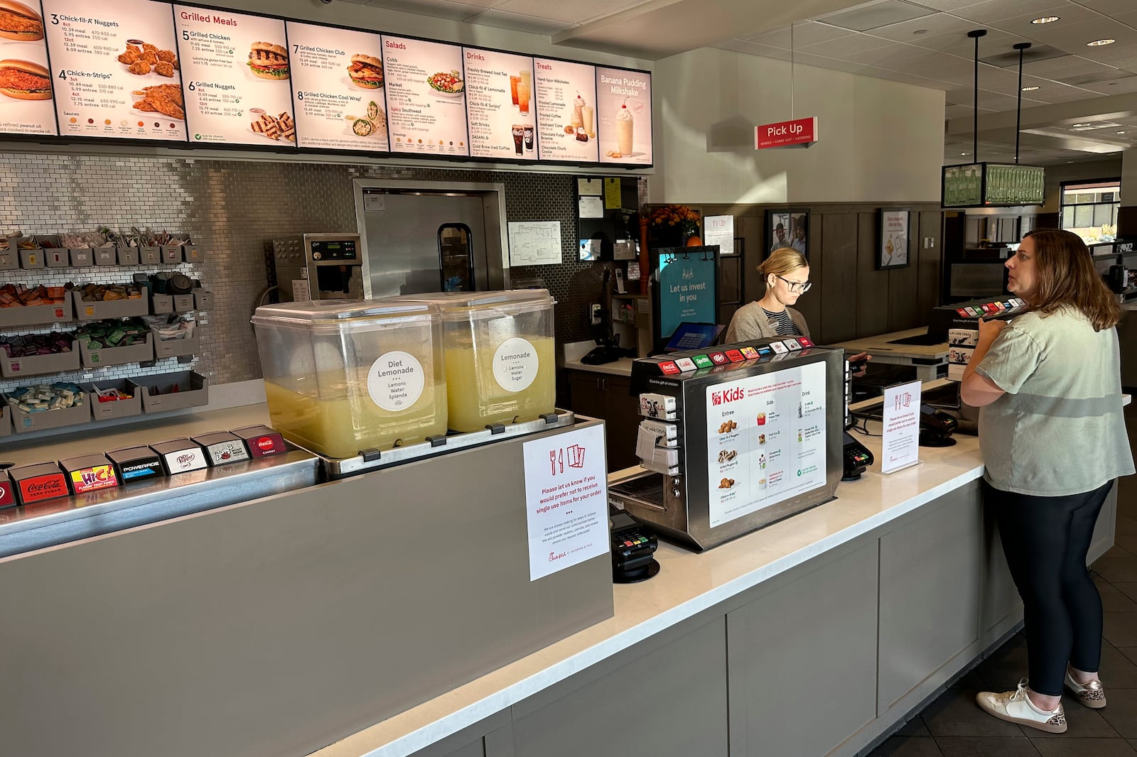 A customer places an order at the counter of a Chick-fil-A restaurant Monday, Oct. 7, 2024, in southeast Denver. (AP Photo/David Zalubowski)