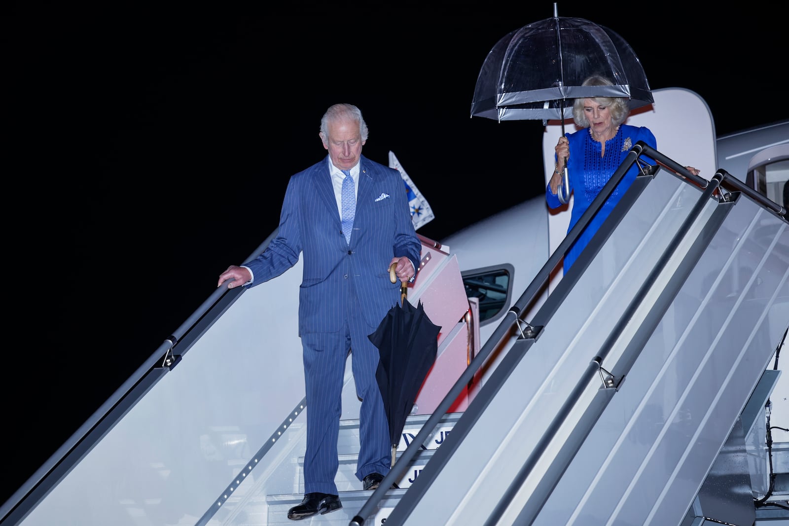 Britain's King Charles III and Queen Camilla arrive in Sydney for the start of a five day tour to Australia, Friday, Oct. 18, 2024. (Brook Mitchell/Pool Photo via AP)