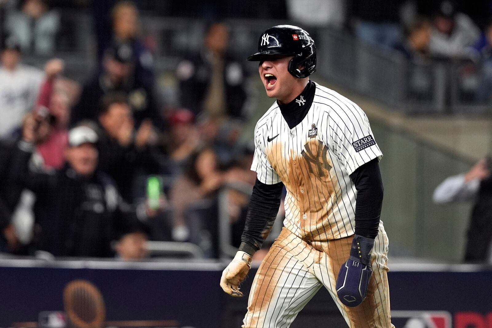 New York Yankees' Anthony Volpe reacts after scoring against the Los Angeles Dodgers during the eighth inning in Game 4 of the baseball World Series, Tuesday, Oct. 29, 2024, in New York. (AP Photo/Godofredo A. Vásquez)