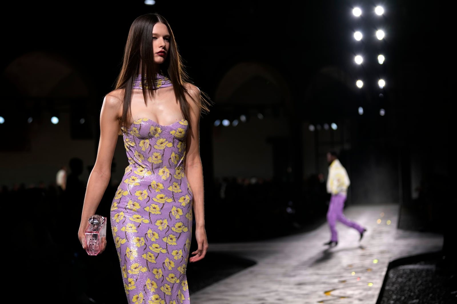 A model wears a creation as part of the Versace Spring Summer 2025 collection, that was presented in Milan, Italy, Friday, Sept. 20, 2024. (AP Photo/Antonio Calanni)