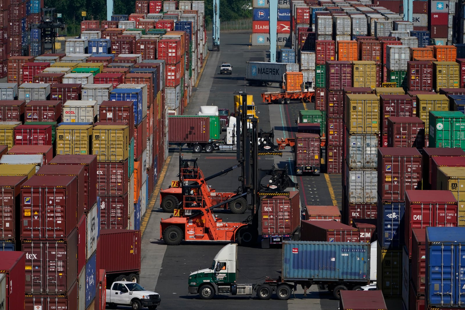 FILE - Containers are moved at the Port of New York and New Jersey in Elizabeth, N.J., on June 30, 2021. (AP Photo/Seth Wenig, File)