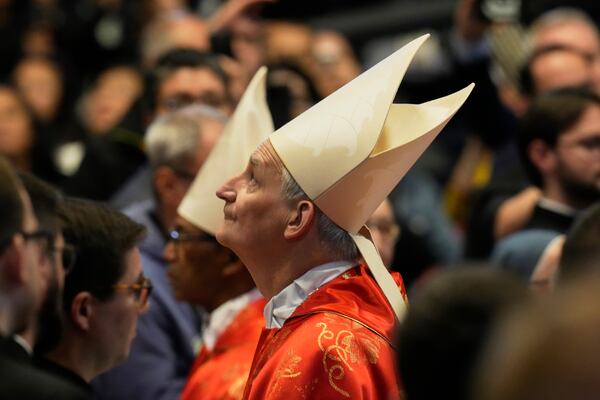 Cardinal Matteo Maria Zuppi looks up during a final Mass celebrated by cardinals inside St. Peter's Basilica, before the conclave to elect a new pope, at the Vatican, Wednesday, May 7, 2025. (AP Photo/Gregorio Borgia)
