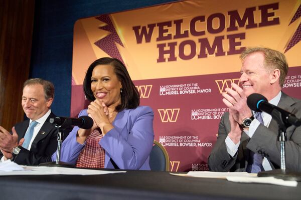 Washington Commanders controlling owner Josh Harris, from left, District of Columbia Mayor Muriel Bowser and NFL Commissioner Roger Goodell announce a new home for the NFL football team on the site of the old RFK Stadium, Monday, April 28, 2025, at the National Press Club in Washington. (AP Photo/Jacquelyn Martin)