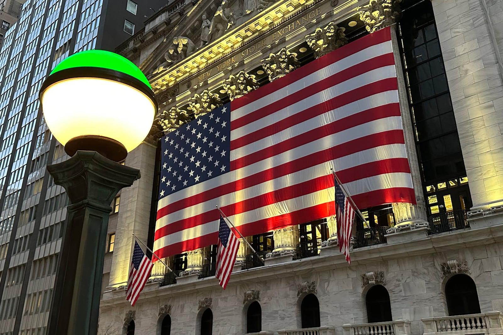 The American flags hangs on the facade of the New York Stock Exchange in New York's Financial District on Tuesday, Nov. 5, 2024. (AP Photo/Peter Morgan)