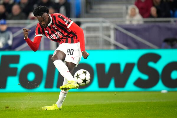 AC Milan's Tammy Abraham scores the third goal against Slovan Bratislava during the Champions League opening phase soccer match between Slovan Bratislava and AC Milan in Bratislava, Slovakia, on Tuesday, Nov. 26, 2024. (AP Photo/Petr David Josek)