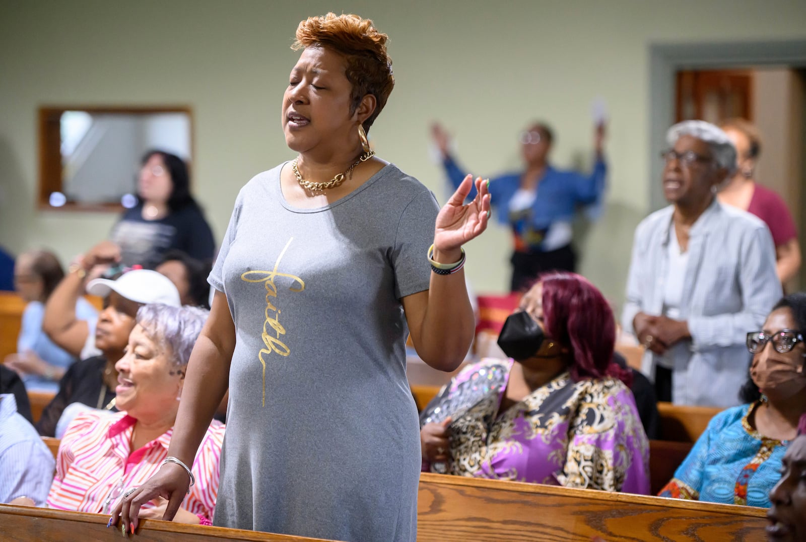 Loreasa Minor, of Turner Station, Md., stands during a service at Mt. Olive Baptist Church, Sunday, Aug. 18, 2024, in Turner Station. Turner Station is located near the former site of the Francis Scott Key Bridge, which collapsed in March. (AP Photo/Steve Ruark)